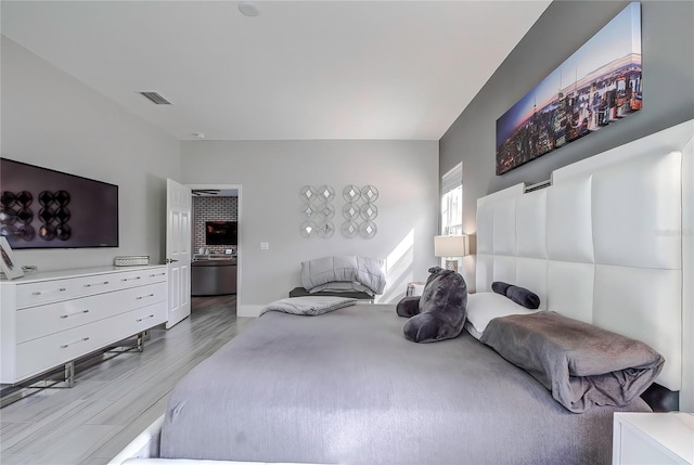 bedroom with light hardwood / wood-style flooring