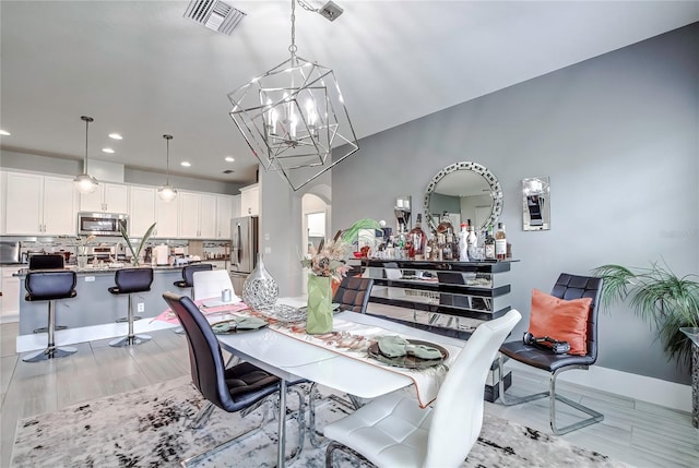 dining space with a notable chandelier