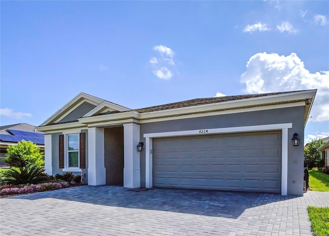 view of front of property with a garage