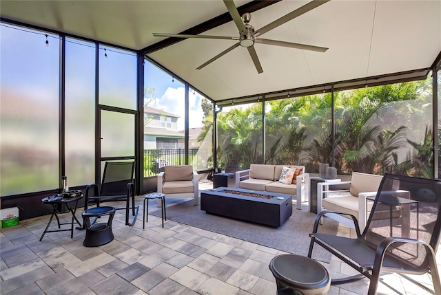 sunroom / solarium with lofted ceiling and ceiling fan