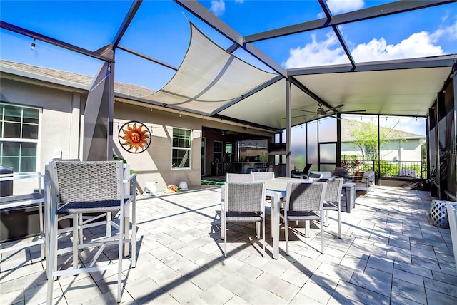 view of patio / terrace featuring a lanai and ceiling fan