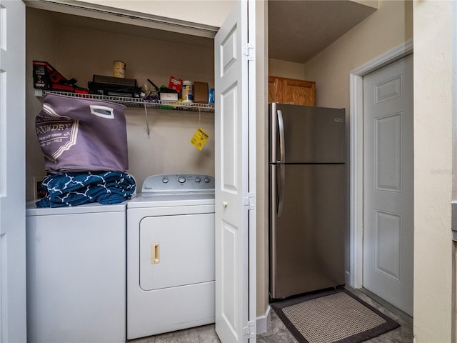 laundry area with separate washer and dryer