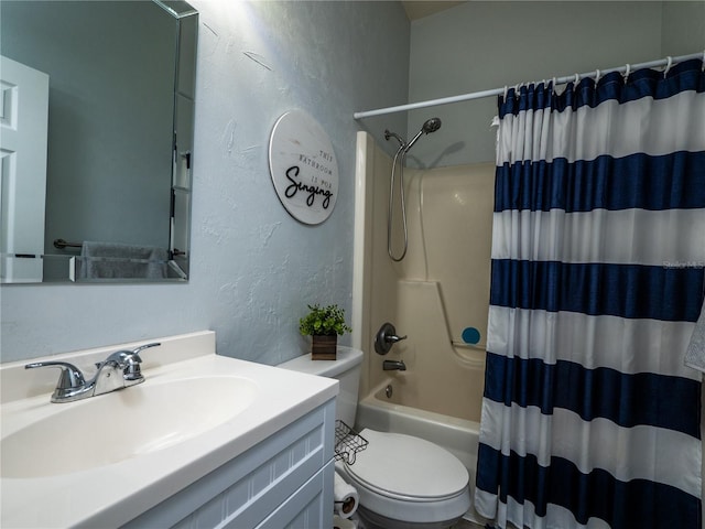 full bathroom featuring vanity, shower / bath combo, and toilet