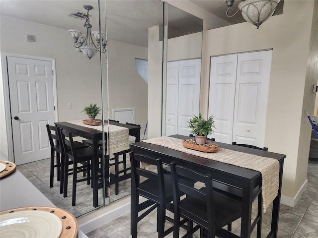 dining area featuring a chandelier