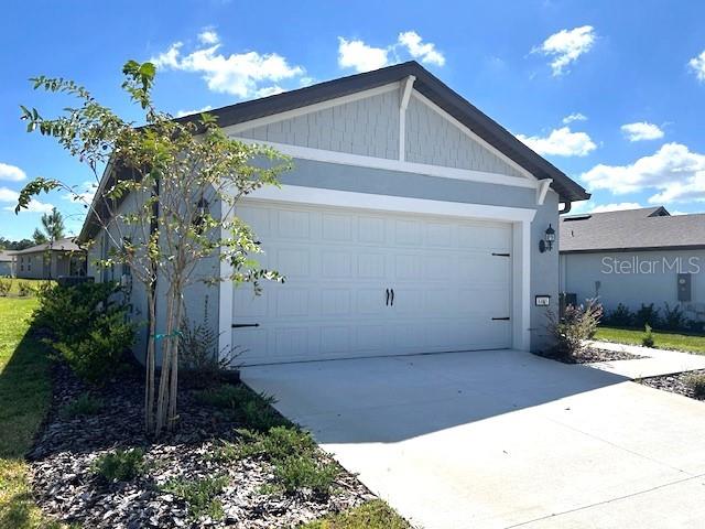 view of side of home with a garage