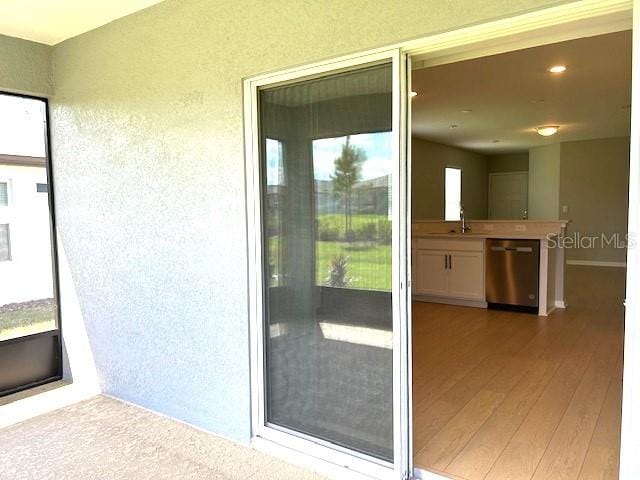 doorway to property featuring sink