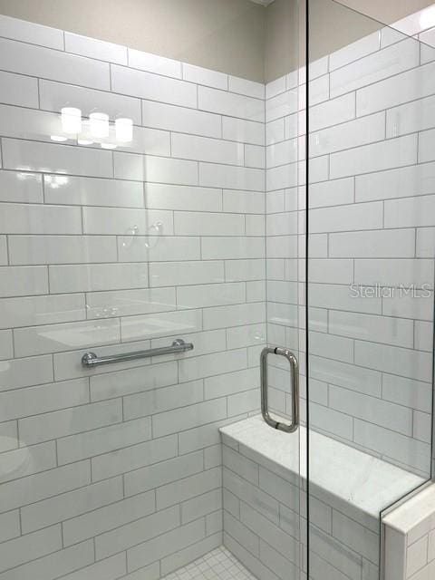 bathroom with an enclosed shower