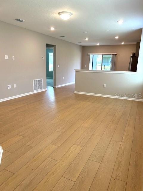 empty room with light wood-type flooring