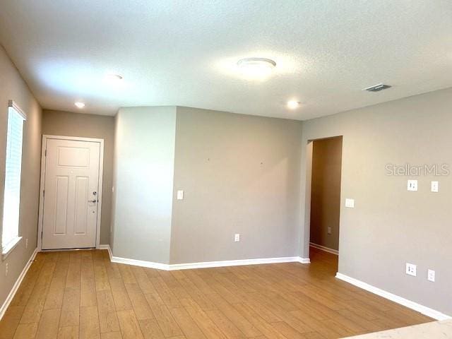 unfurnished room featuring light wood-type flooring