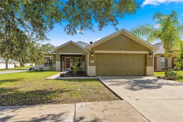 ranch-style home with a front lawn and a garage