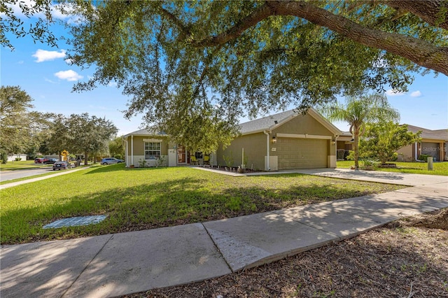 ranch-style home with a garage and a front lawn