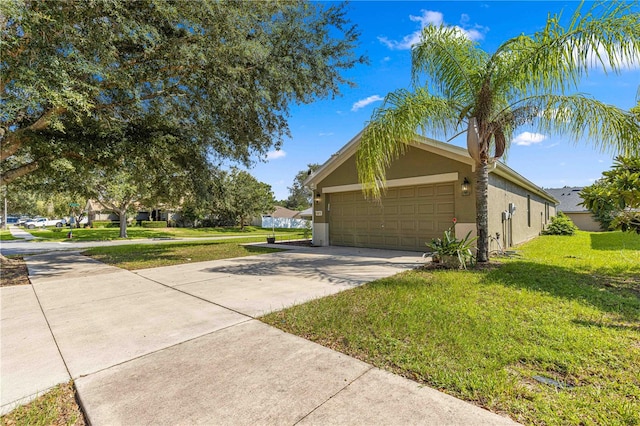 view of side of home with a garage and a yard