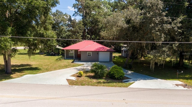 view of front facade with a front yard and a garage