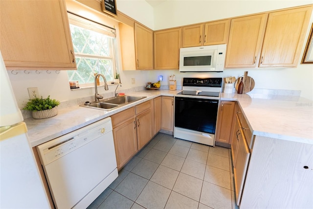 kitchen with white appliances, light brown cabinetry, light tile patterned flooring, and sink