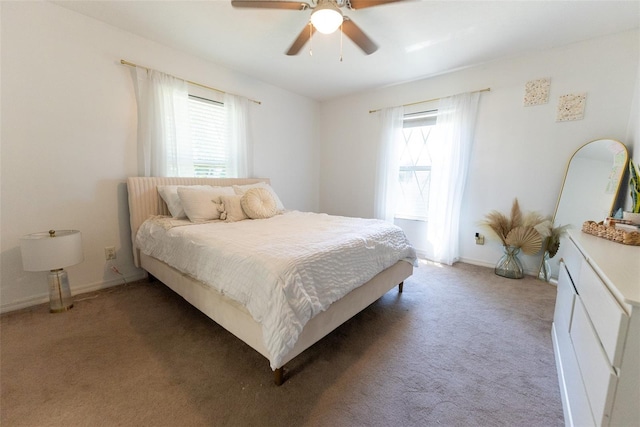 bedroom featuring multiple windows, carpet, and ceiling fan