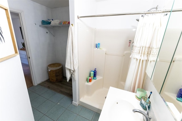 bathroom featuring a shower with shower curtain and tile patterned floors