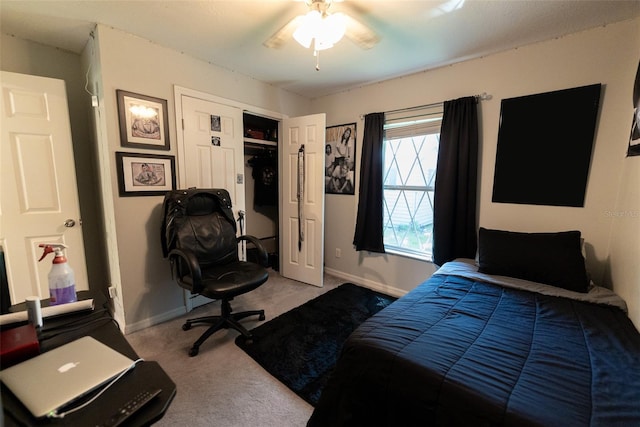 carpeted bedroom featuring a closet and ceiling fan