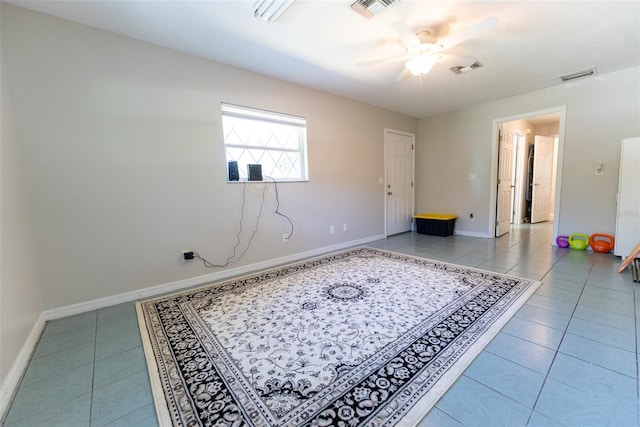 interior space featuring light tile patterned flooring and ceiling fan