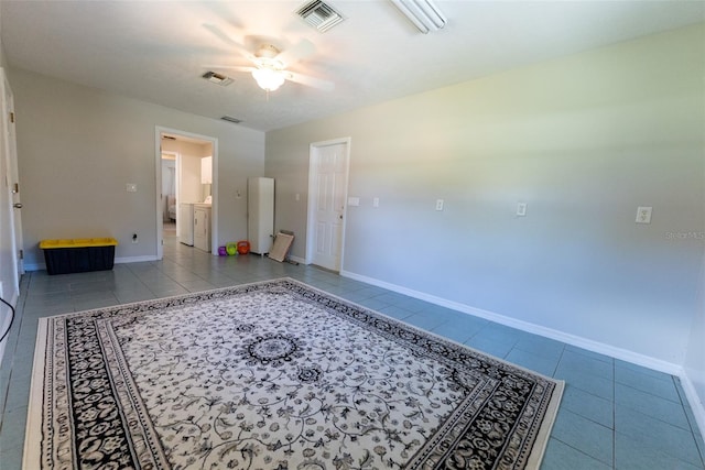 interior space featuring ceiling fan and light tile patterned flooring