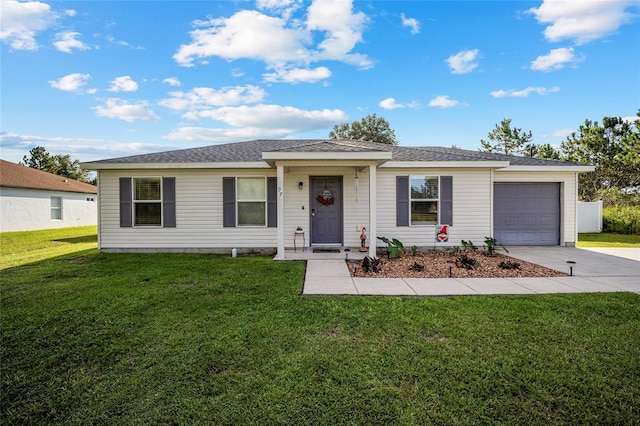 ranch-style house with a garage and a front lawn