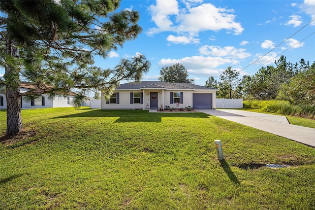 single story home featuring a front yard and a garage