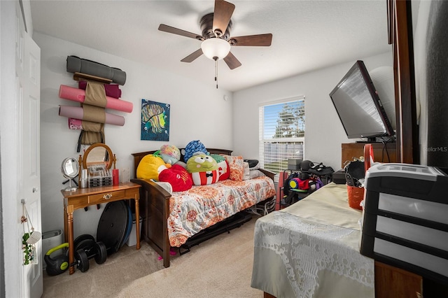 bedroom with ceiling fan and light colored carpet