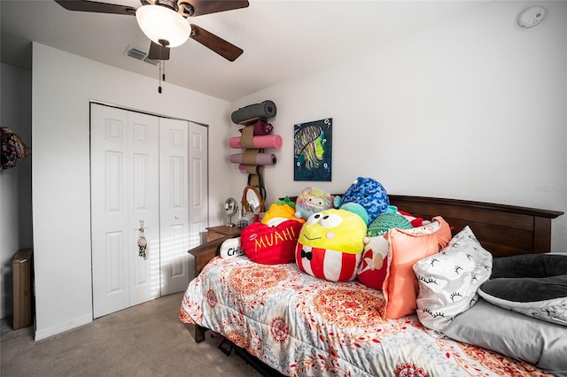 bedroom with carpet, ceiling fan, and a closet