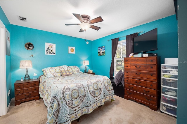 carpeted bedroom with ceiling fan