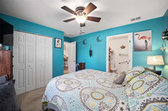 carpeted bedroom featuring ceiling fan, a closet, and ensuite bathroom