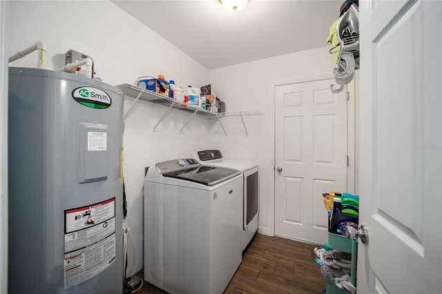 laundry room with electric water heater, a textured ceiling, dark hardwood / wood-style floors, and washer and dryer