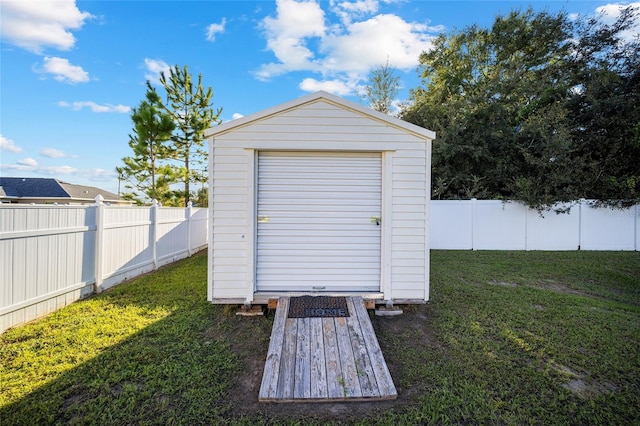 view of outdoor structure featuring a lawn