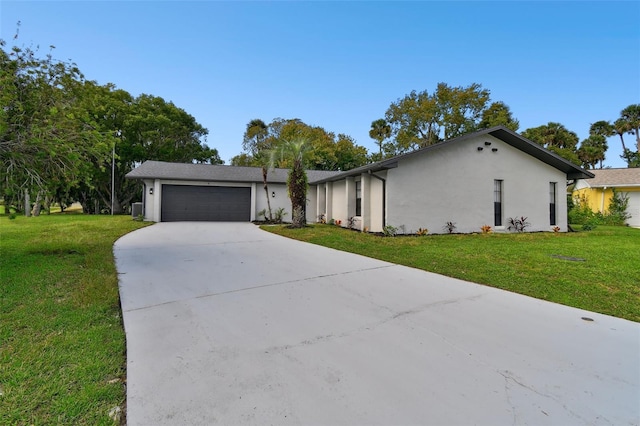 ranch-style house with a garage and a front lawn