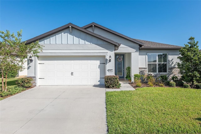 craftsman-style house featuring a garage and a front yard