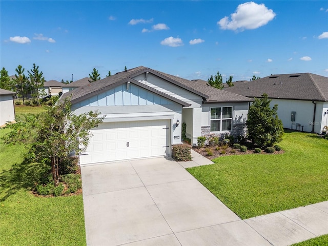 single story home featuring a front lawn and a garage