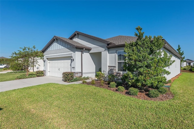 view of front of house with a garage and a front lawn