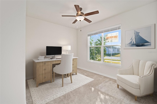 office area featuring ceiling fan and light colored carpet