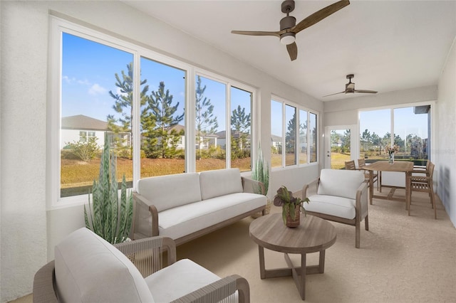 sunroom / solarium featuring ceiling fan