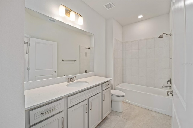 full bathroom with tile patterned floors, vanity, toilet, and tiled shower / bath