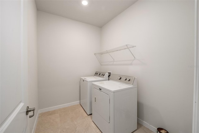 washroom with light tile patterned floors and independent washer and dryer