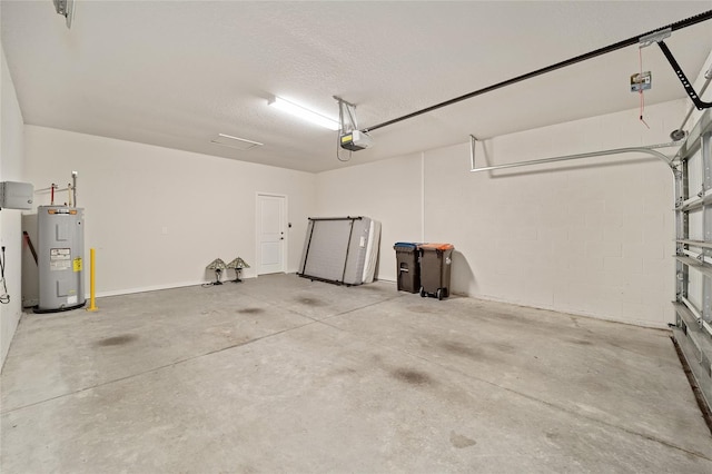 garage with electric water heater and a garage door opener