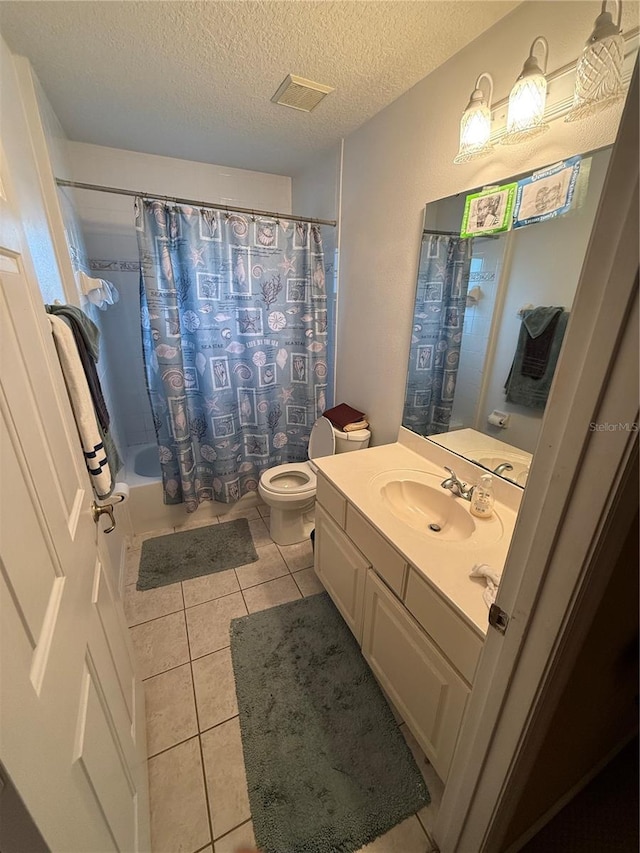 full bathroom featuring tile patterned flooring, a textured ceiling, shower / bathtub combination with curtain, vanity, and toilet