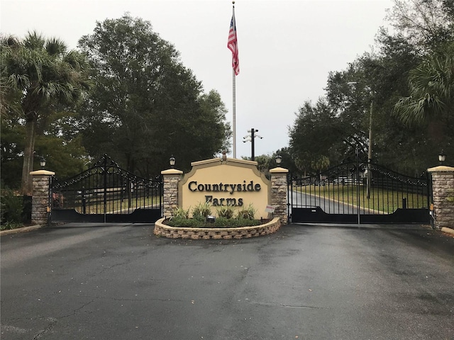 9526 SW 72nd Ct, Ocala, FL 34476 - community / neighborhood sign with a gate