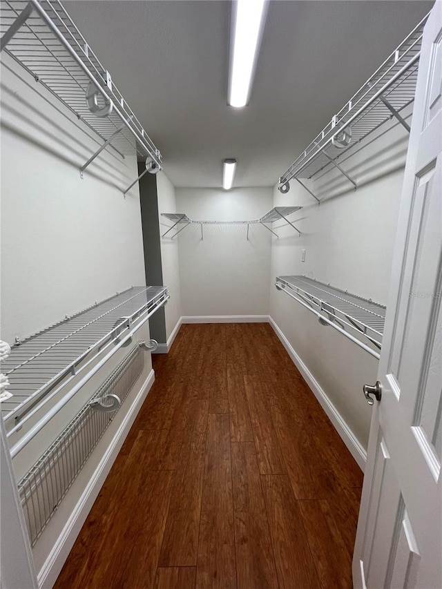 9526 SW 72nd Ct, Ocala, FL 34476 - walk in closet featuring wood finished floors