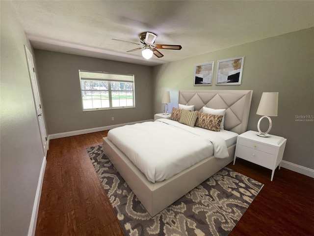 bedroom with ceiling fan and dark hardwood / wood-style floors