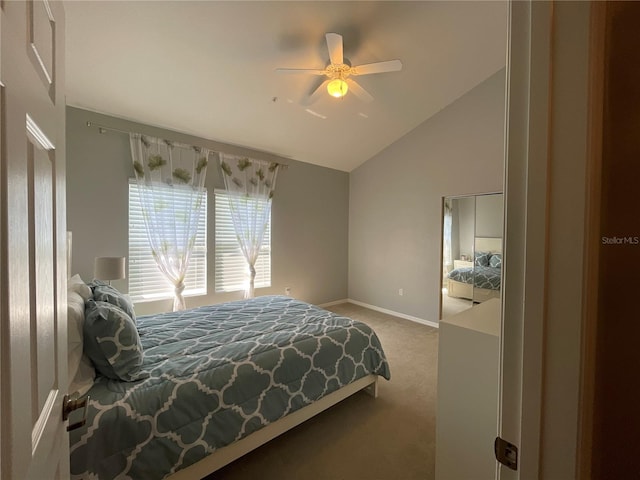 bedroom with lofted ceiling, carpet flooring, and ceiling fan