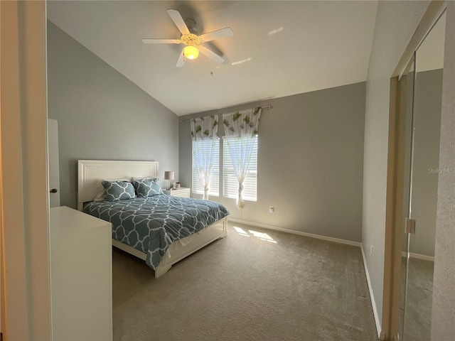 bedroom featuring ceiling fan, vaulted ceiling, and carpet