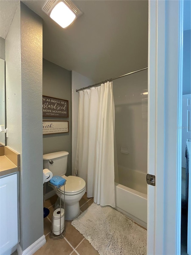 full bathroom with shower / bathtub combination with curtain, toilet, vanity, and tile patterned floors