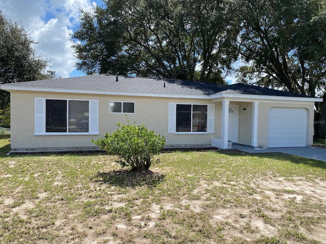 ranch-style house with a front lawn and a garage