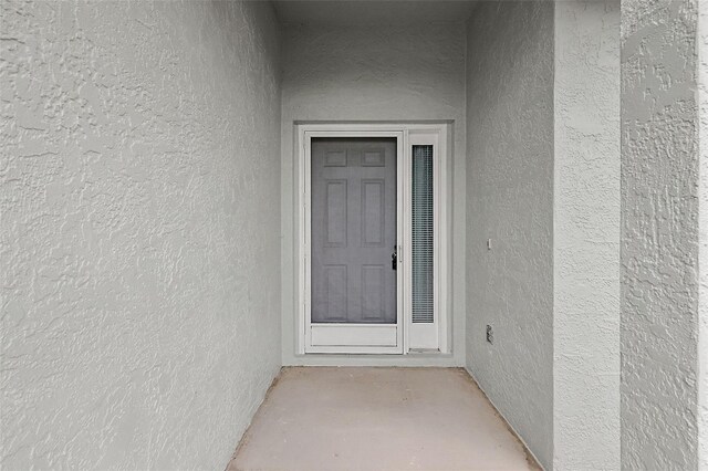 2051 NW 50th Ave, Ocala, FL 34482 - view of exterior entry featuring stucco siding
