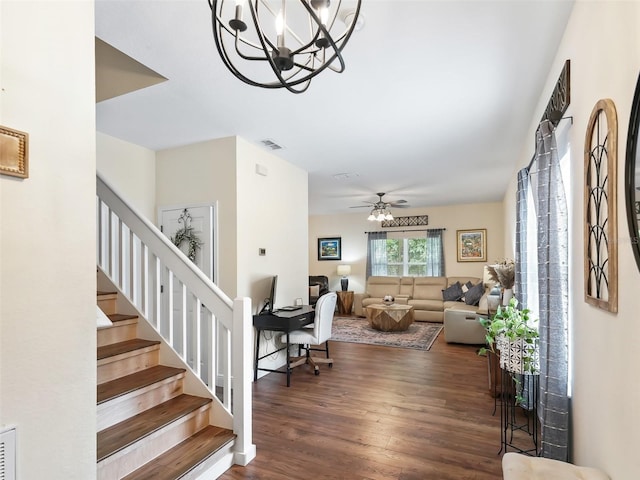 interior space with hardwood / wood-style floors and ceiling fan with notable chandelier